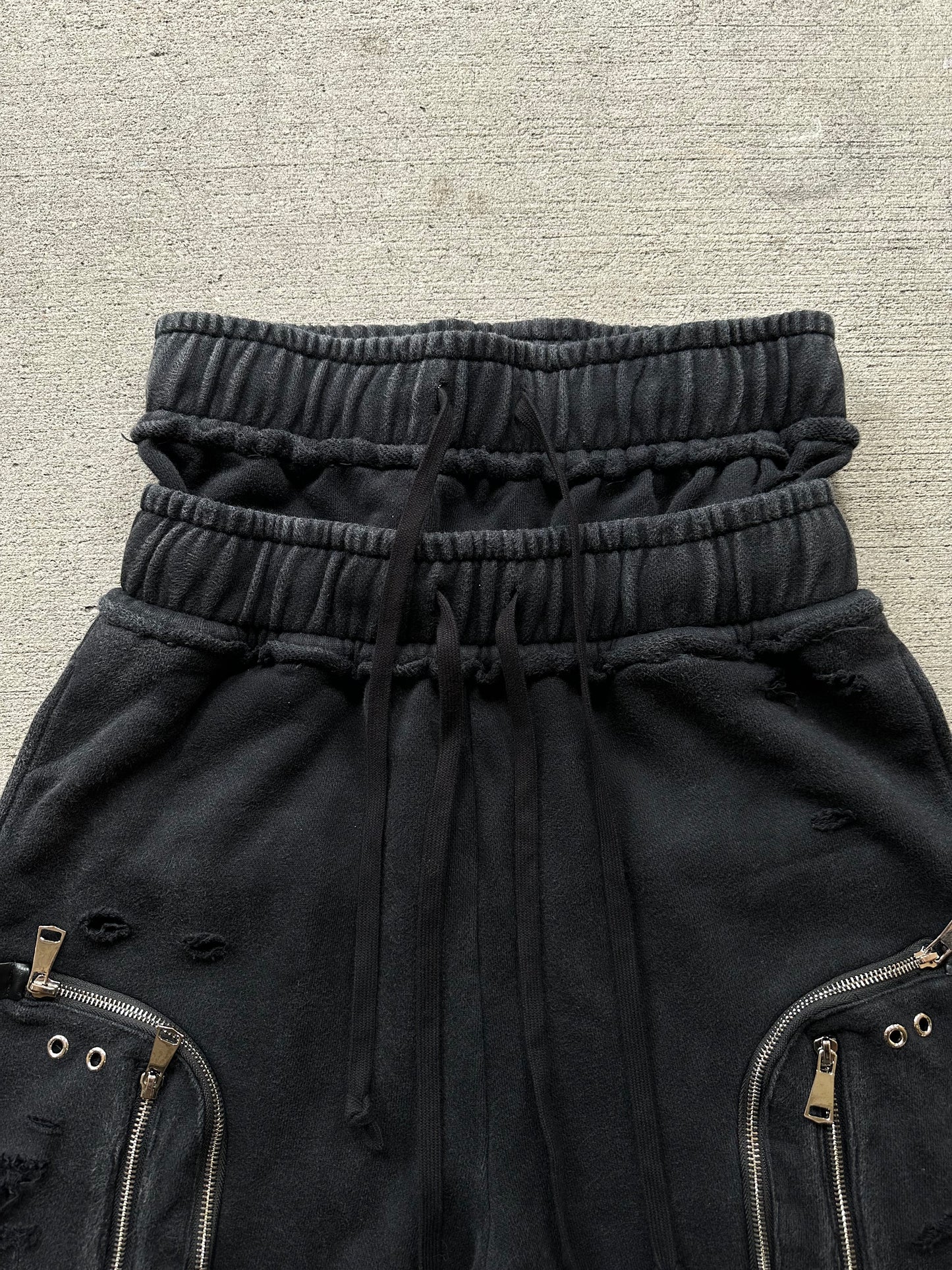 DISTRESSED ZIP PLUS SHORTS